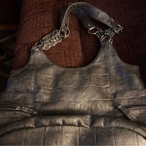 Nicole by Nicole Miller silver purse.